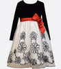 Bonnie Jean black stretch velvet and white embroidered bonaz dress with long sleeves and a red satin waist bow.